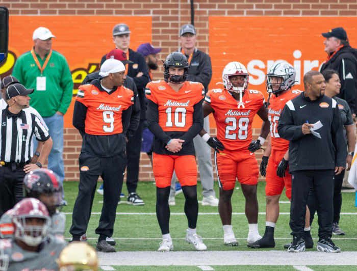 Former Washington QB Michael Penix Jr.(9) and former Oregon QB Bo Nix (10) watch the action from the sideline during the Reese's Senior Bowl in Mobile, Alabama on Saturday, Feb. 3, 2024.